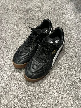 Puma Black Leather Sneakers with White Formstrip and Gum Sole